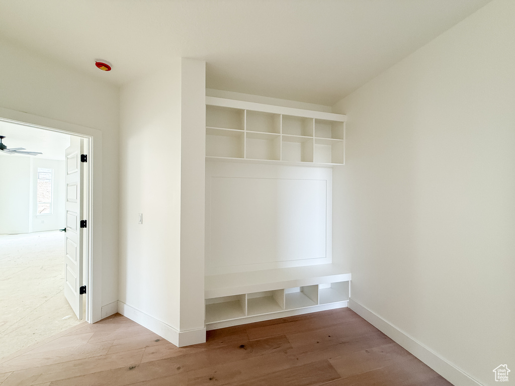 Mudroom featuring wood finished floors and baseboards