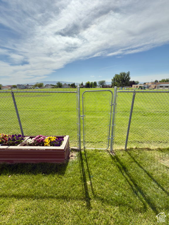 View of yard featuring a gate and a rural view