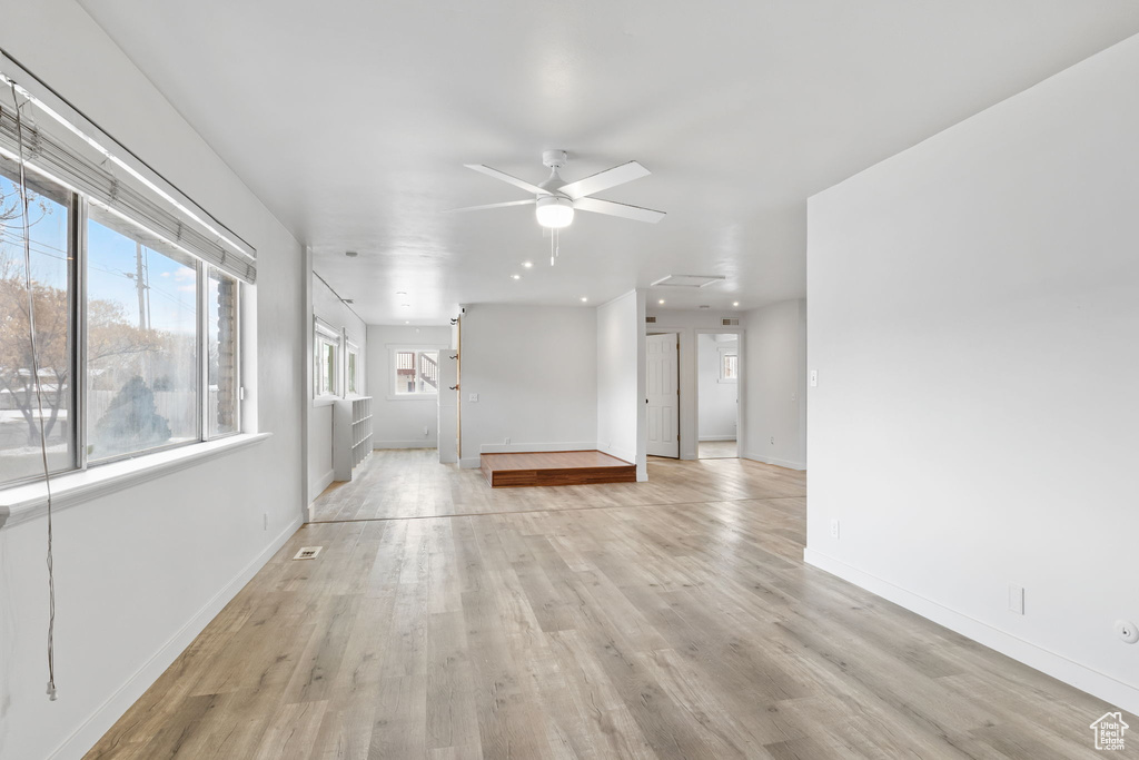 Interior space with light hardwood / wood-style flooring and ceiling fan