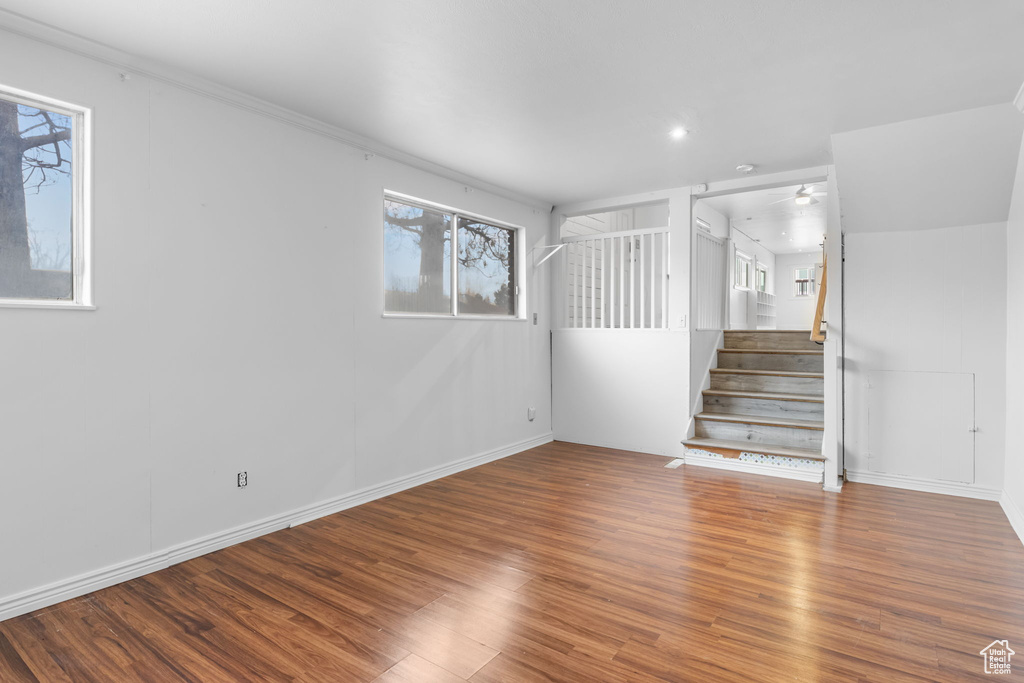 Interior space with hardwood / wood-style floors and ceiling fan