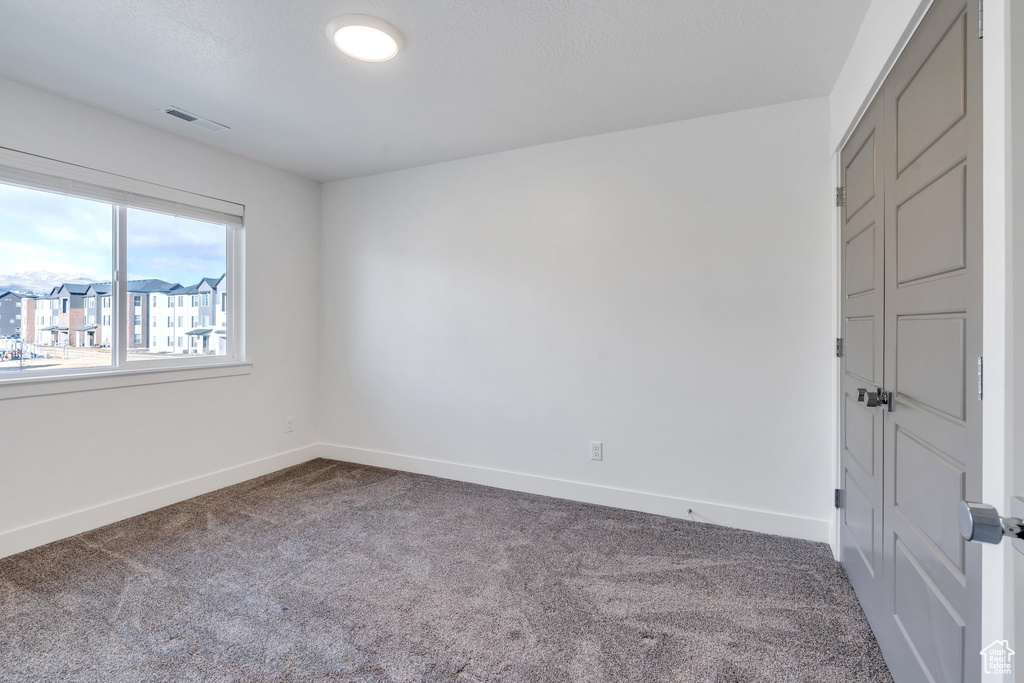 Spare room with carpet