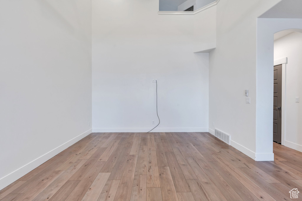 Unfurnished room featuring light wood-type flooring