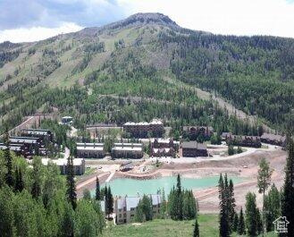 Mountain view featuring a water view
