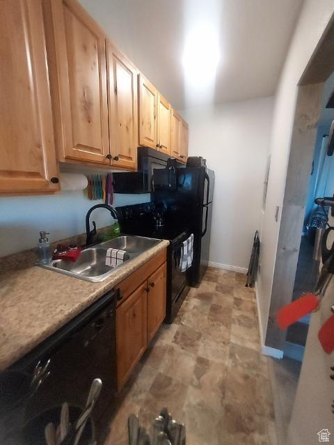 Kitchen featuring sink and black appliances