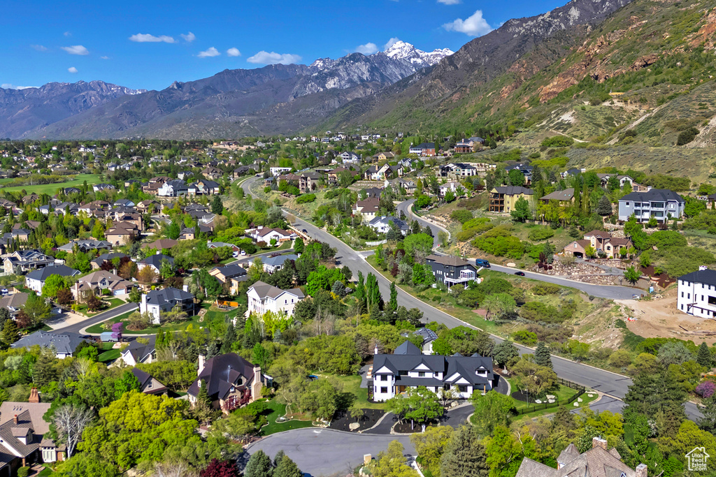 Birds eye view of property with a residential view and a mountain view