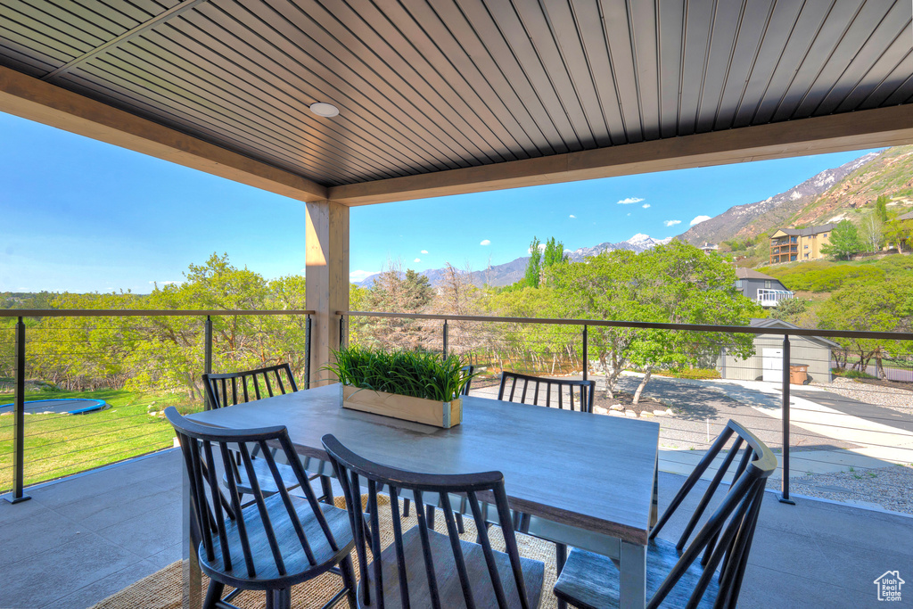 View of patio featuring outdoor dining area and a mountain view