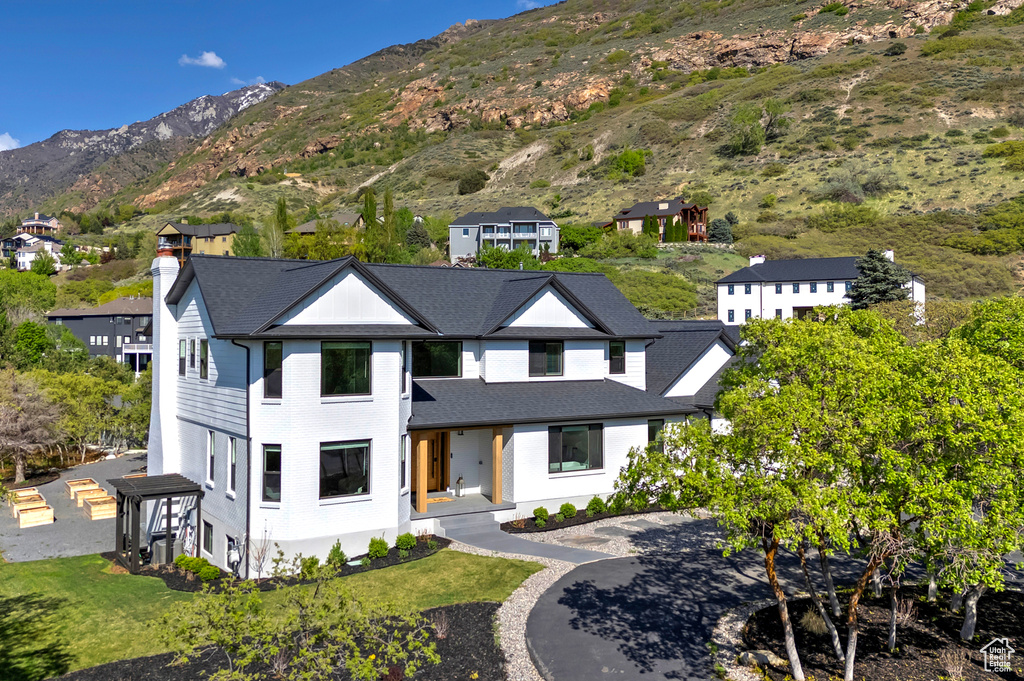 View of front of home featuring a mountain view