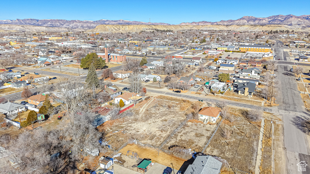 Birds eye view of property with a mountain view