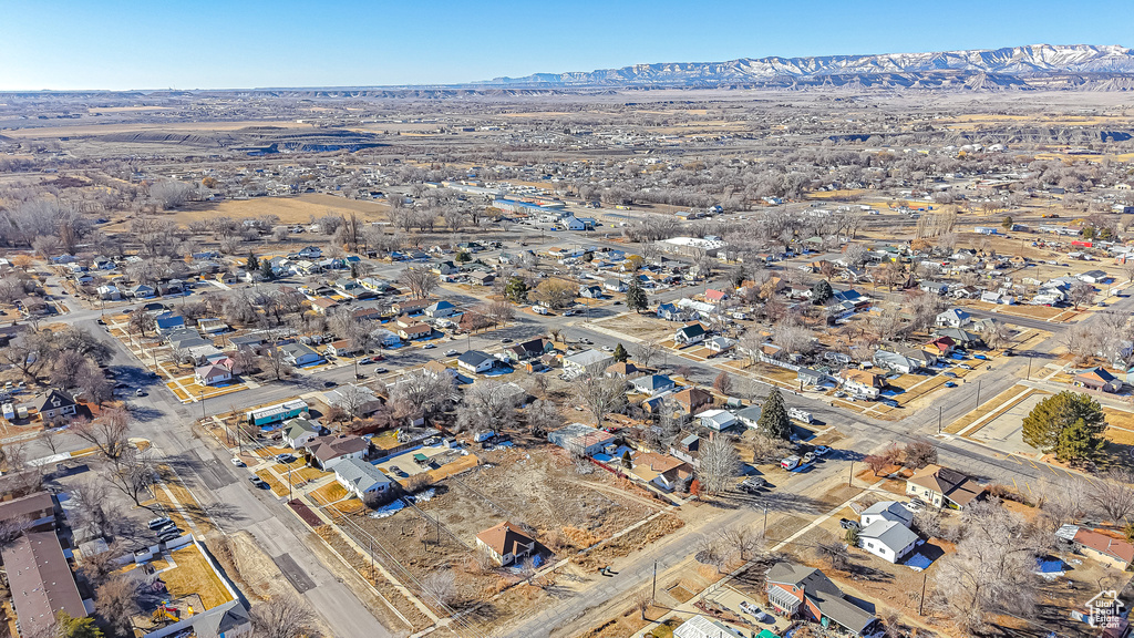 Birds eye view of property with a mountain view