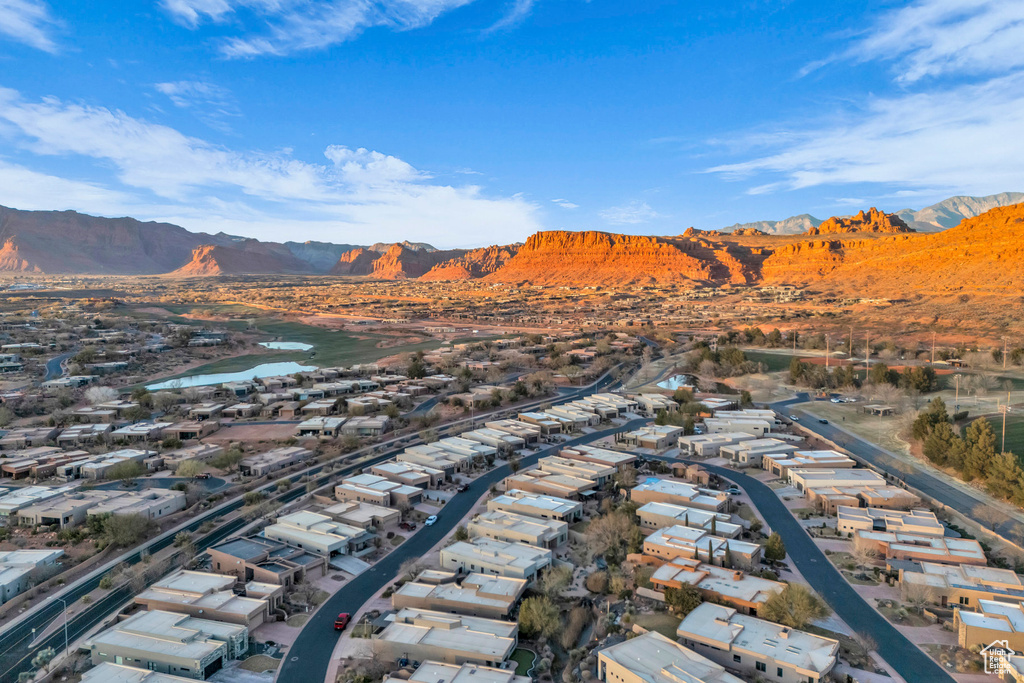 Drone / aerial view featuring a water and mountain view