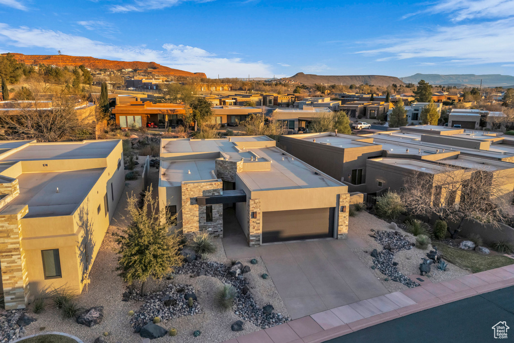 Birds eye view of property with a mountain view