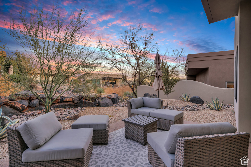 Patio terrace at dusk with an outdoor hangout area