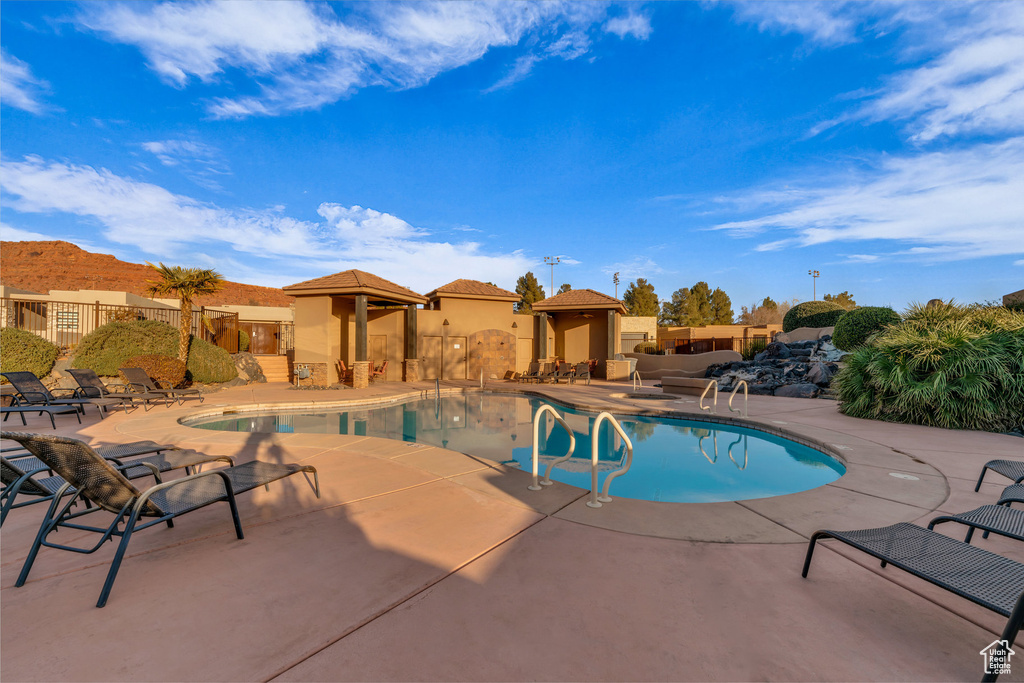 View of swimming pool featuring a gazebo and a patio area