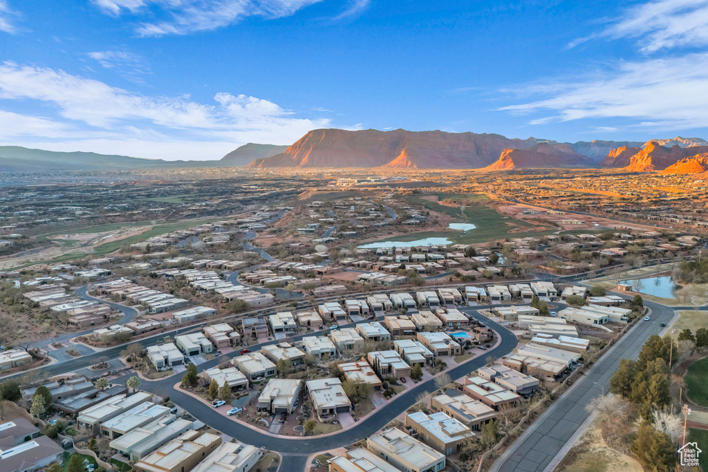 Drone / aerial view featuring a water and mountain view