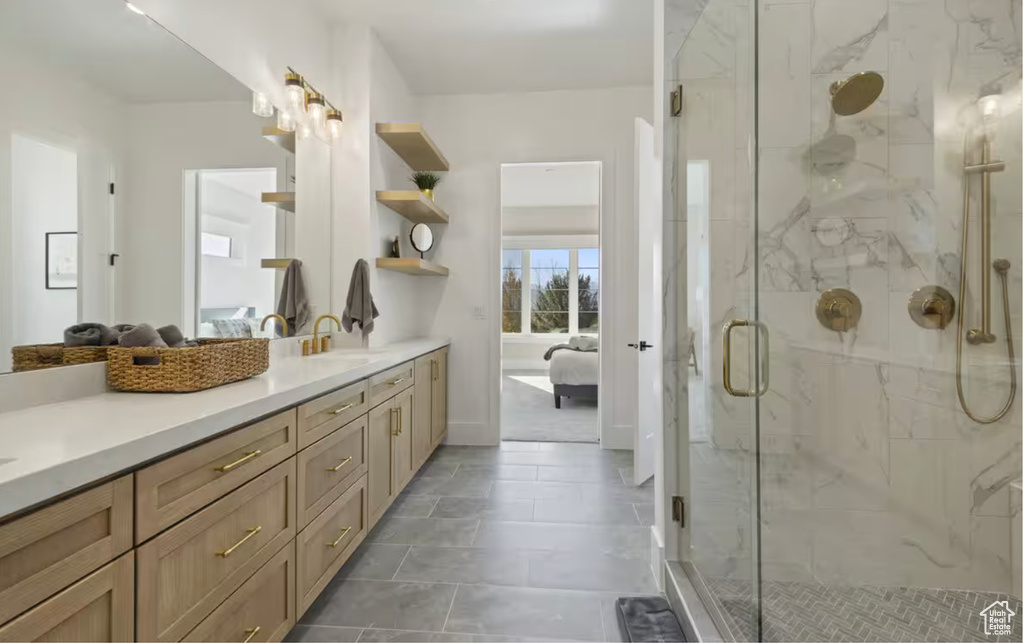 Ensuite bathroom with a marble finish shower and vanity