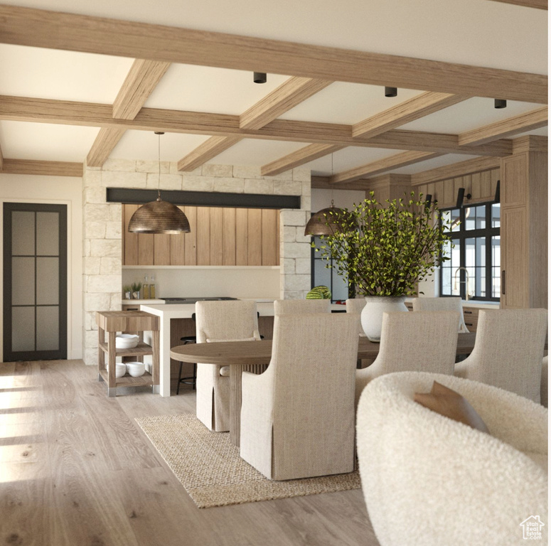 Dining room with beamed ceiling, coffered ceiling, and light hardwood / wood-style floors