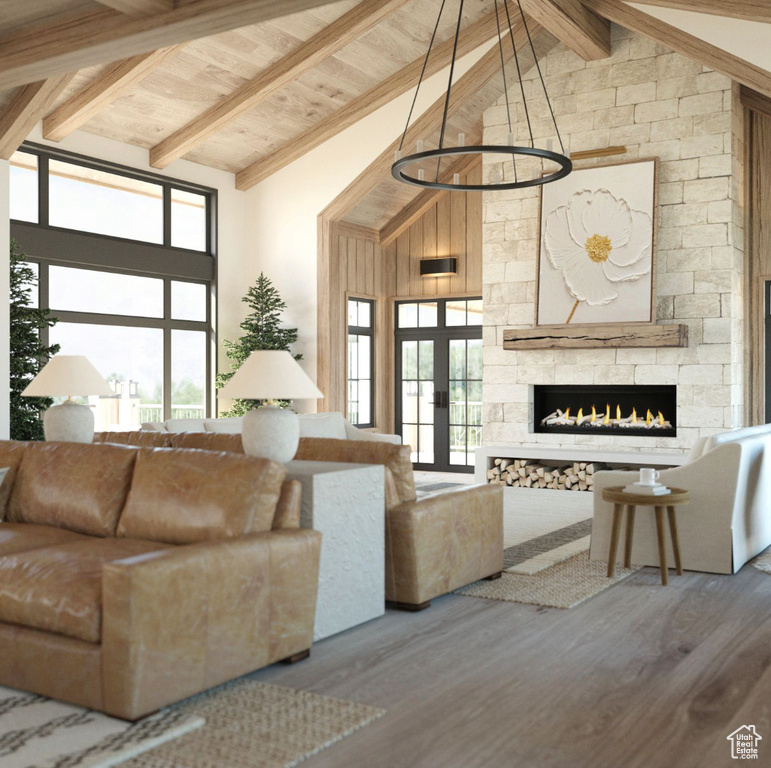 Living room featuring a wealth of natural light, high vaulted ceiling, hardwood / wood-style floors, and beam ceiling