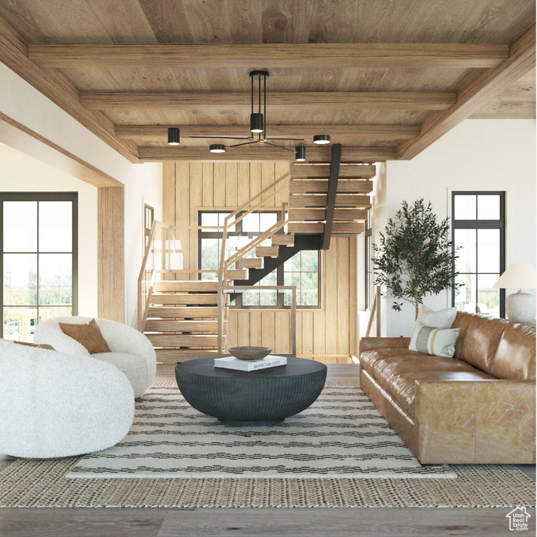 Living room featuring beamed ceiling and wooden ceiling