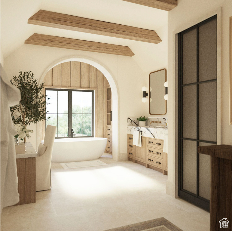 Bathroom with vanity, a bath, and lofted ceiling with beams