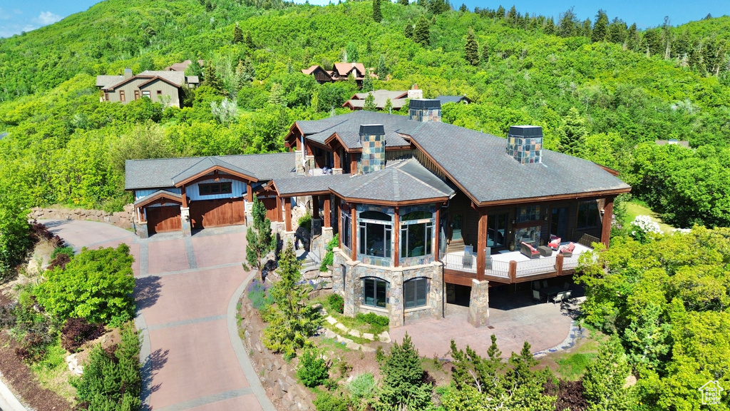 View of subject property featuring a heavily wooded area