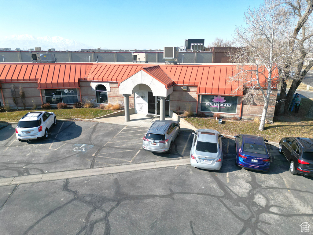 View of front of property with cooling unit