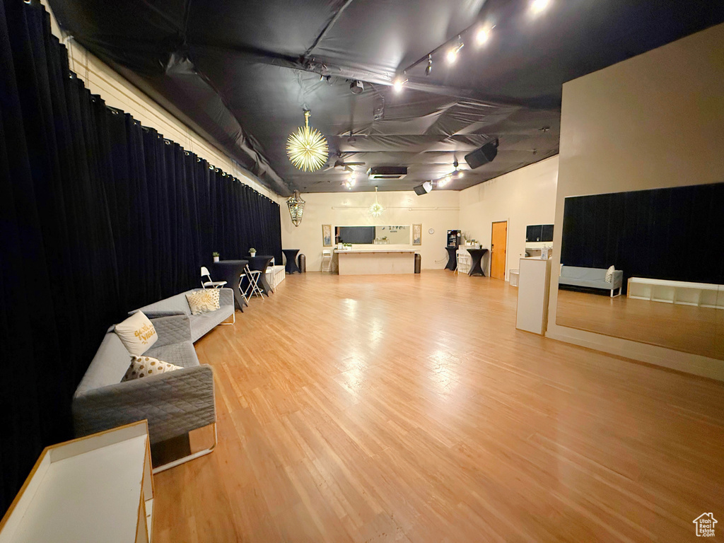 Miscellaneous room featuring wood finished floors and track lighting