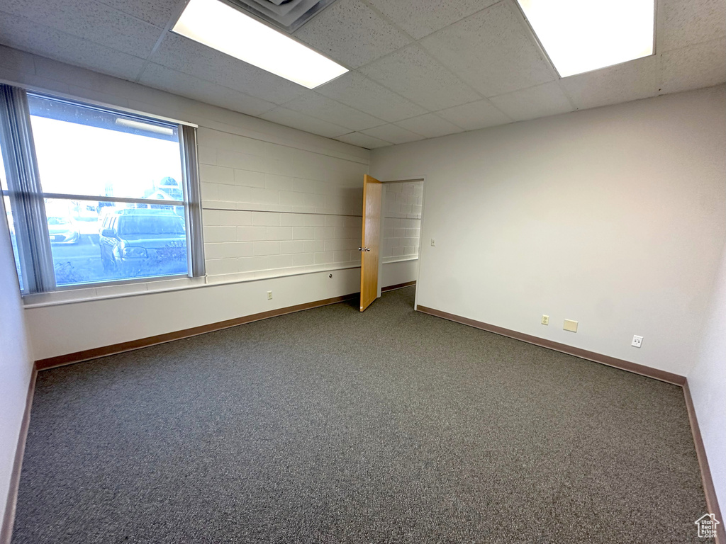 Carpeted empty room with a paneled ceiling
