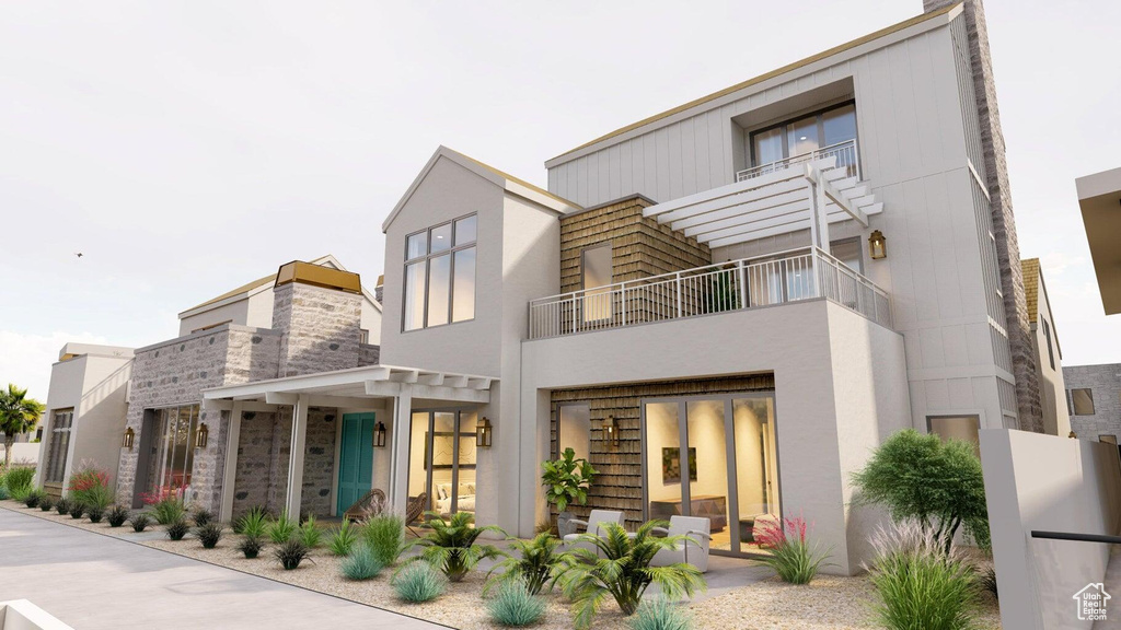 Rear view of property with a pergola