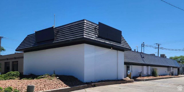 View of side of property featuring stucco siding