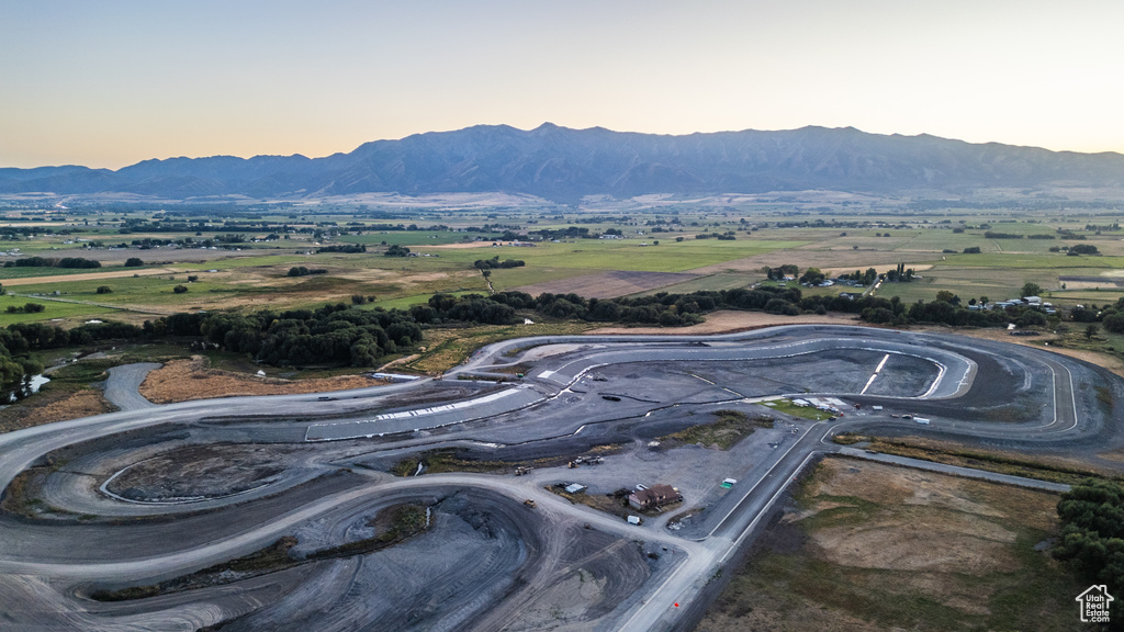 Aerial view at dusk featuring a mountain view