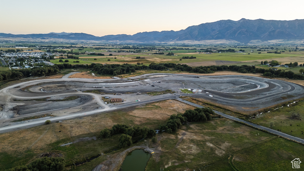 Aerial view at dusk featuring a mountain view