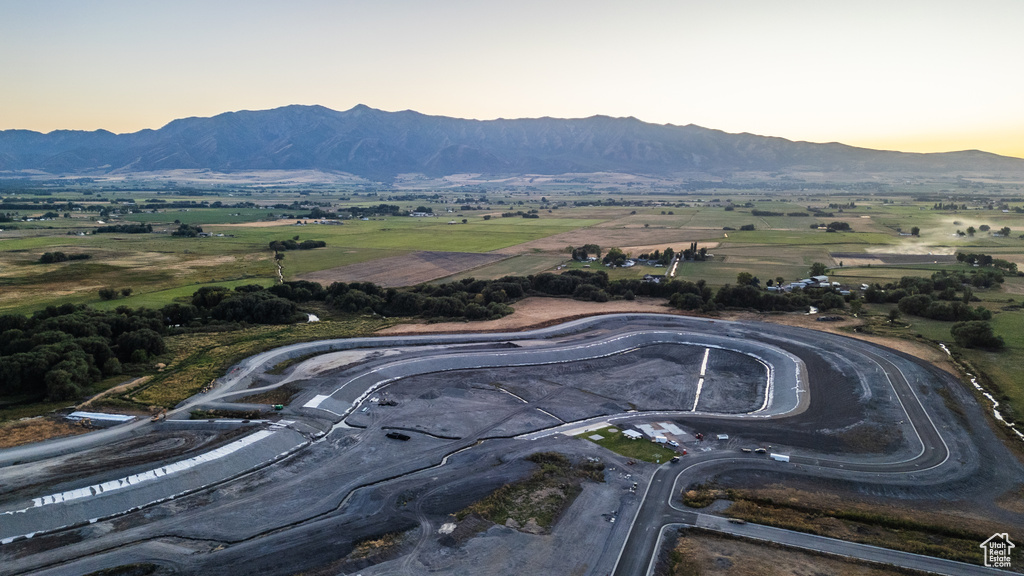 Aerial view at dusk featuring a mountain view