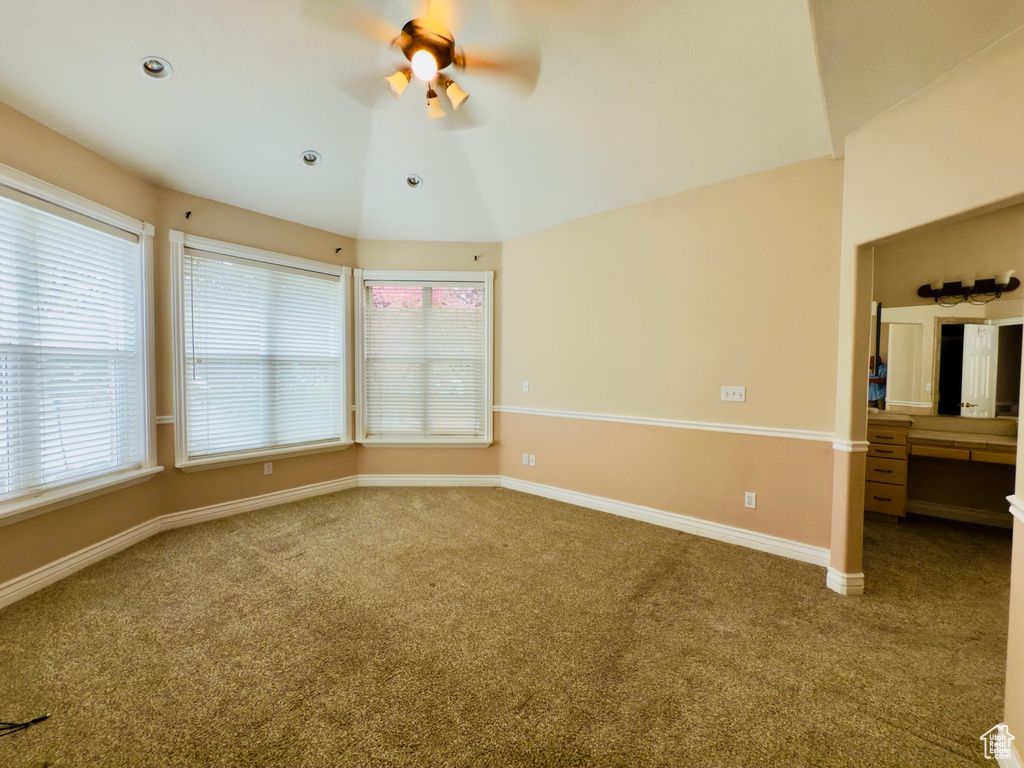Spare room featuring ceiling fan and carpet flooring