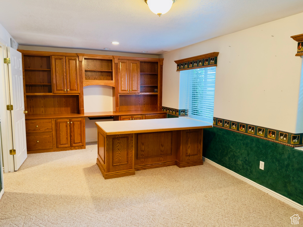 Unfurnished office featuring light carpet, built in study area, and recessed lighting