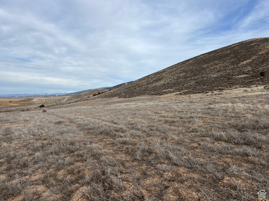 Property view of mountains with a rural view