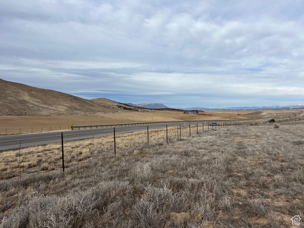 Property view of mountains with a rural view