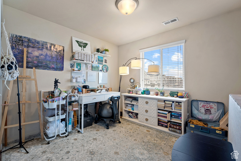 Office with carpet floors and visible vents