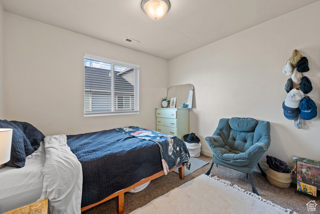 Bedroom with carpet and visible vents
