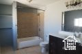 Bathroom with vanity and bathing tub / shower combination