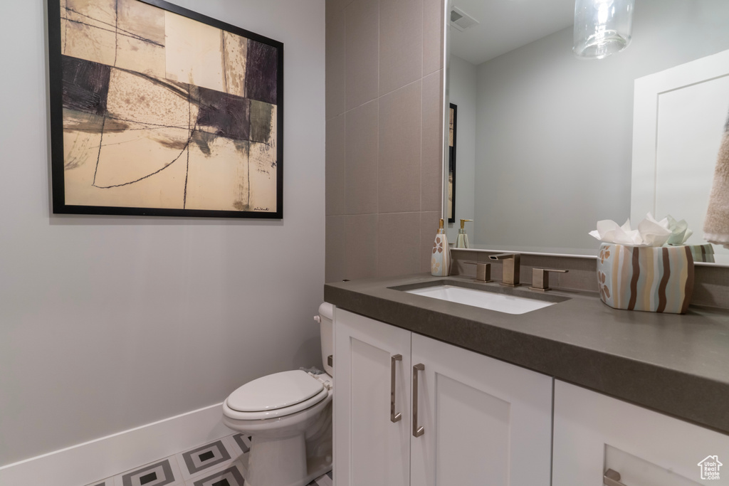 Bathroom with vanity and toilet