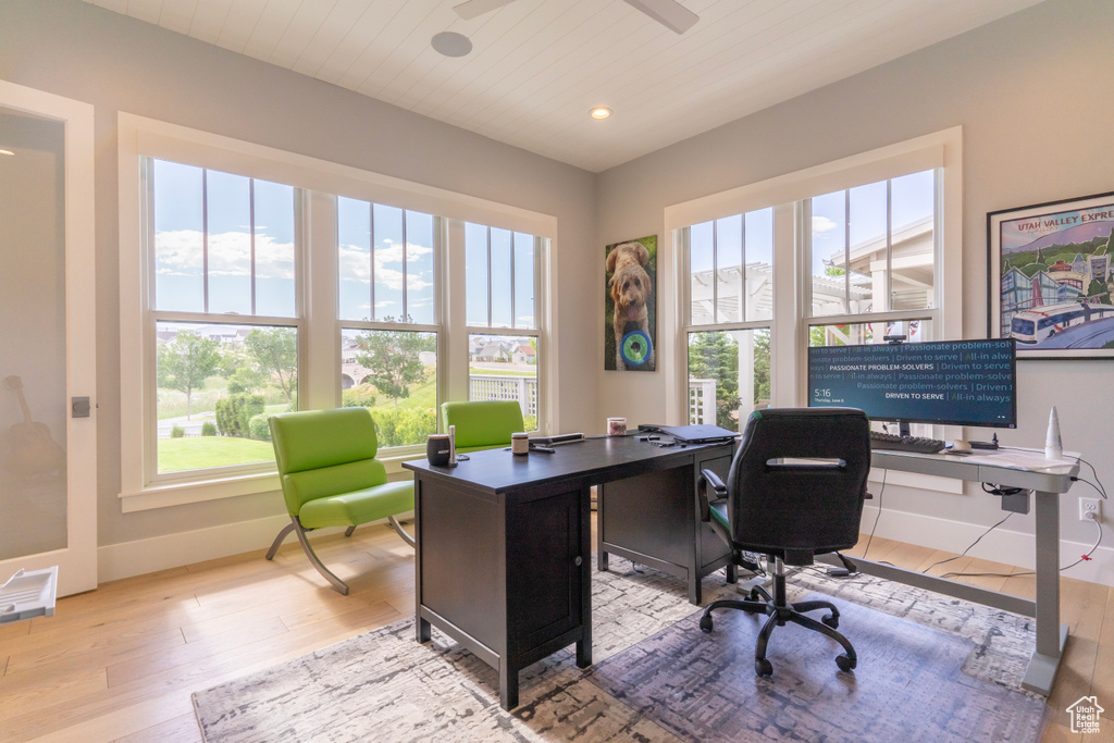 Office with light wood-type flooring