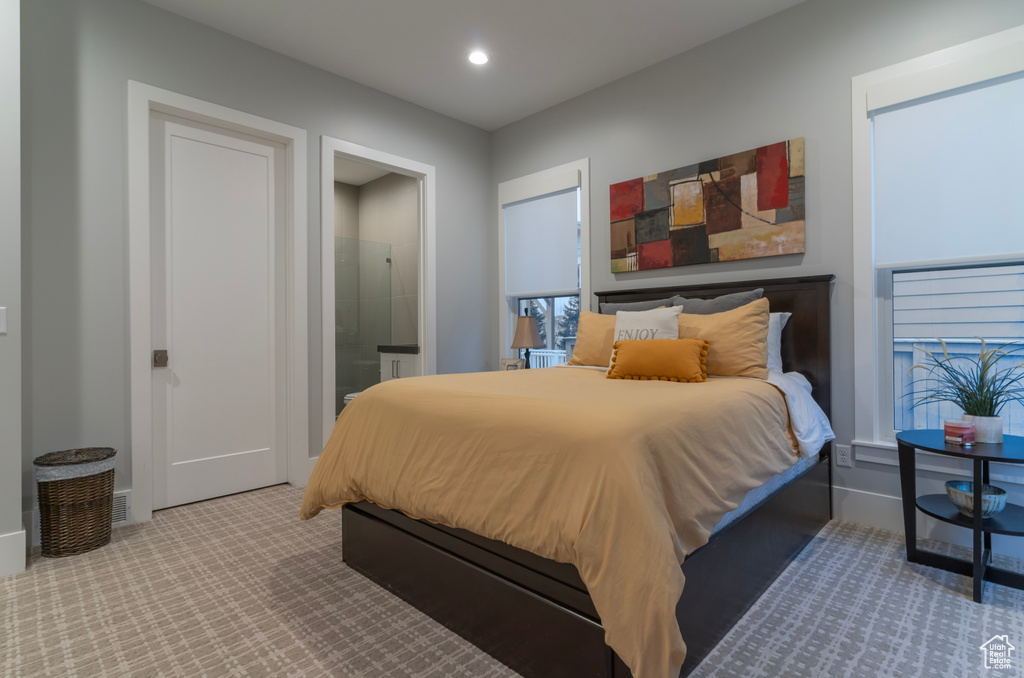 Carpeted bedroom with ensuite bath
