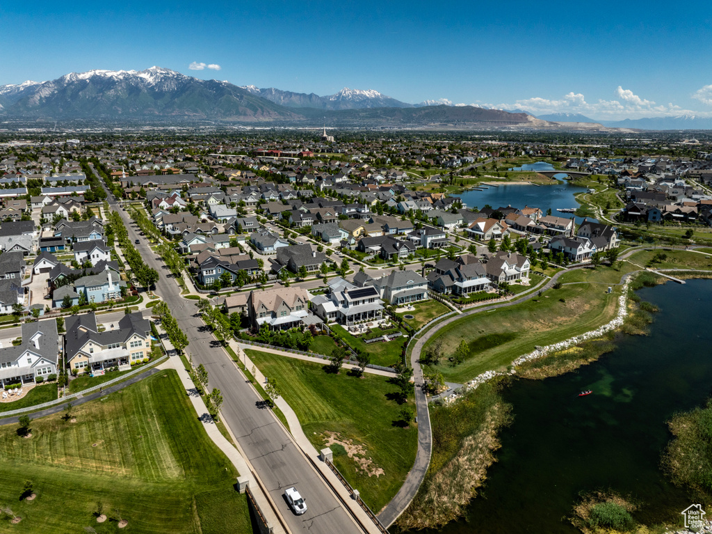 Drone / aerial view featuring a water and mountain view