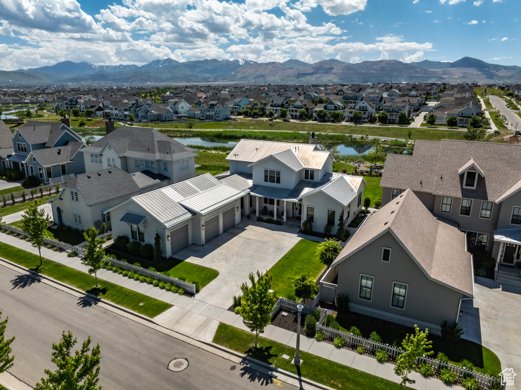 Drone / aerial view with a water and mountain view