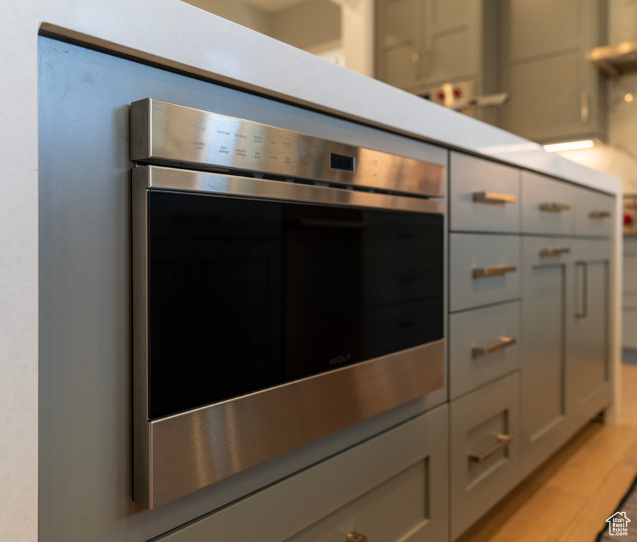 Room details featuring a mail area and stainless steel oven