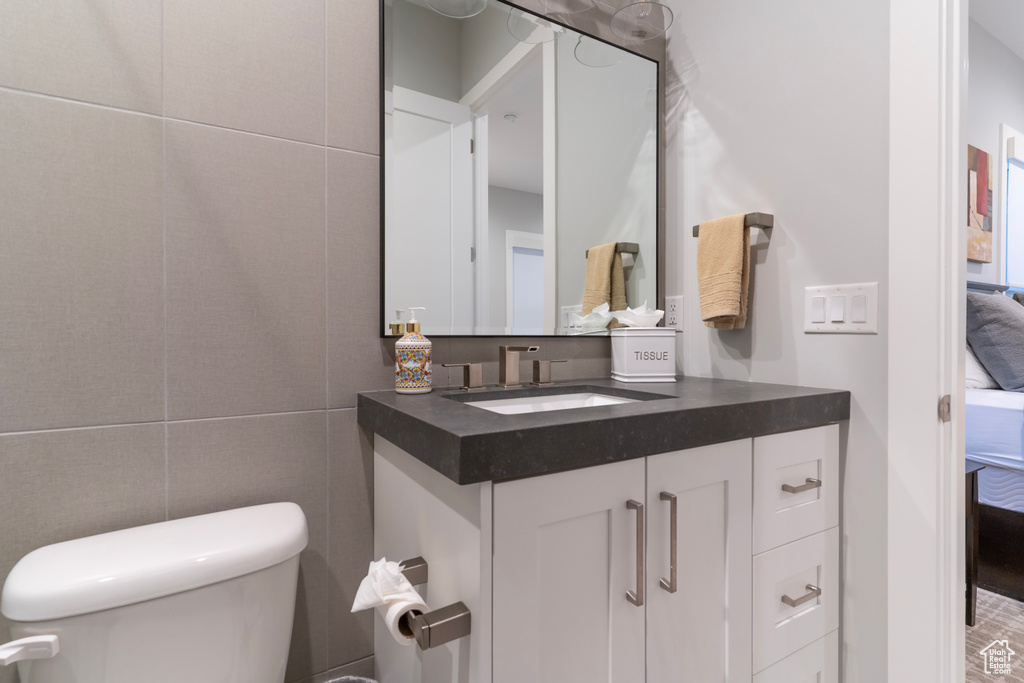 Bathroom featuring vanity and toilet