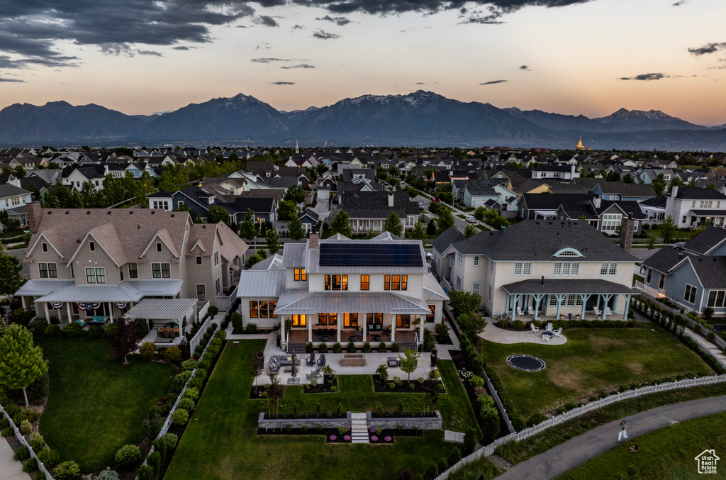 Aerial view at dusk featuring a mountain view