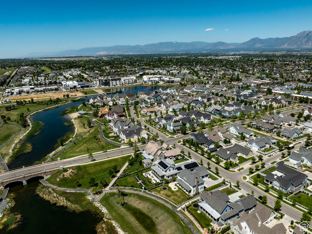 Drone / aerial view featuring a water and mountain view