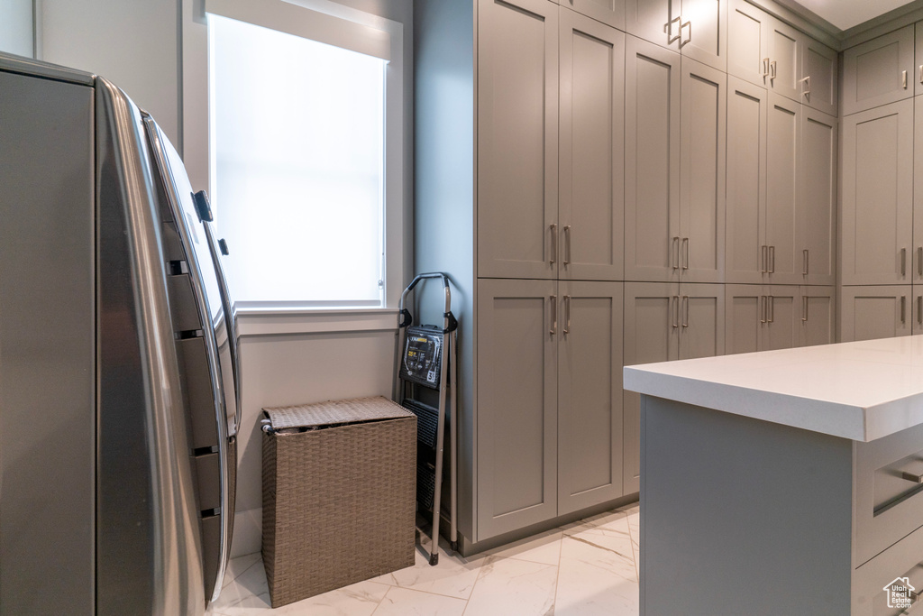 Kitchen featuring gray cabinets
