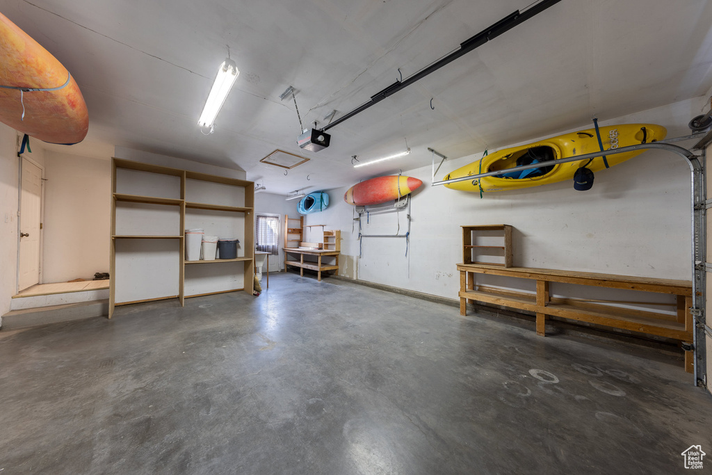 Garage featuring a garage door opener